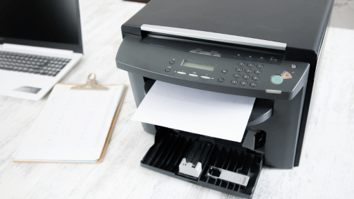 Photo of office printer with paper